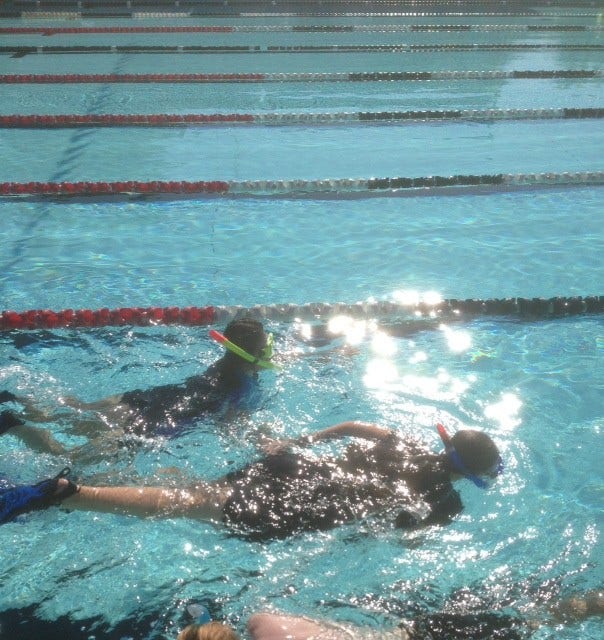 Students snorkeling in the pool.